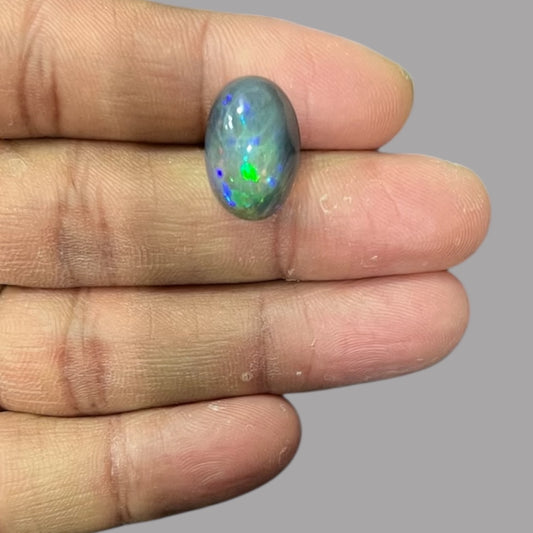 Natural Black Ethiopian Opal Stone 9.61 Carats Oval Cabochon Shape Size 17.7 x 12.2 x 9.5 mm 
