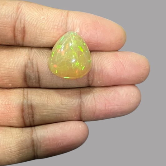 Natural Golden Ethiopian Opal Stone 19.54 Carats Pear Cabochon Shape 20.5 x 18.8 x 11.4 mm