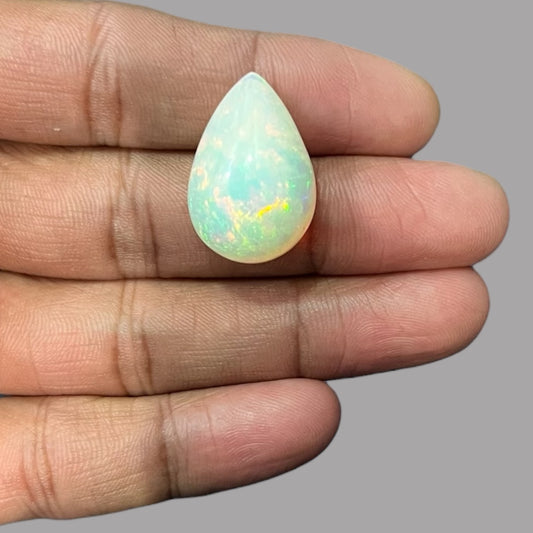 Natural White Color Ethiopian Opal Stone 19.53 Carats Pear Cabochon Shape 25.4 x 17.2 x 11.1 mm