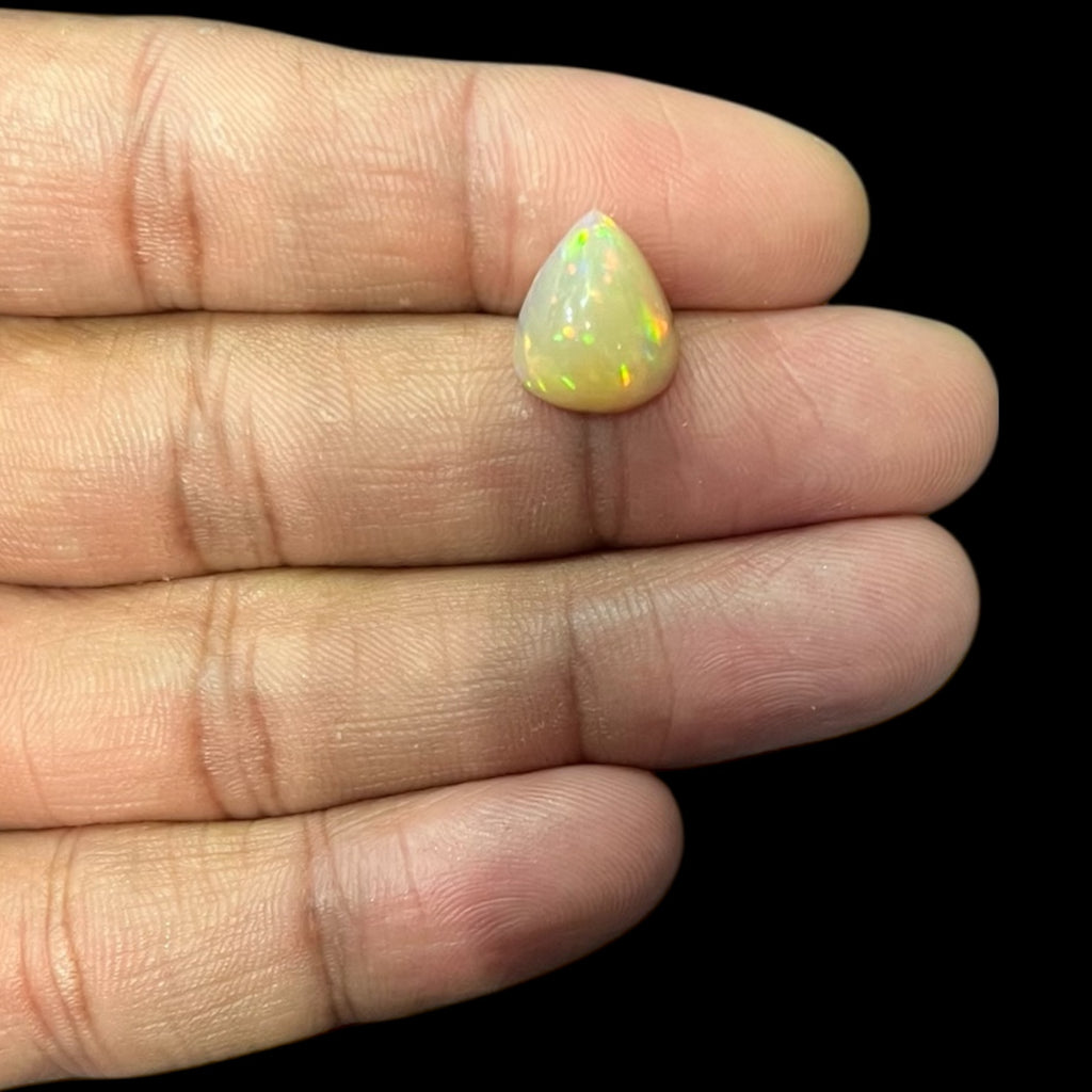 Natural White Color Ethiopian Opal Stone 4.59 Carats Pear Cabochon Shape 13.2 x 10.9 x 8 mm
