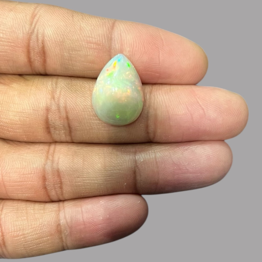 Natural White Color Ethiopian Opal Stone 8.08 Carats Pear Cabochon Shape 19.1 x 14 x 7.7 mm