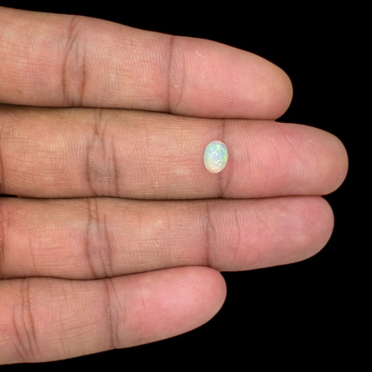 Natural White Ethiopian Opal Stone 0.4.1 Carats Oval Cabochon Shape 6.9 x 5 mm