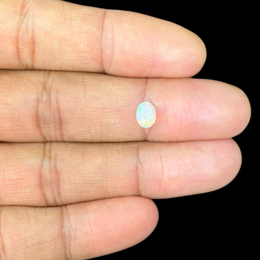 Natural White Ethiopian Opal Stone 0.58 Carats Oval Cabochon Shape 7.1 x 5.2 mm