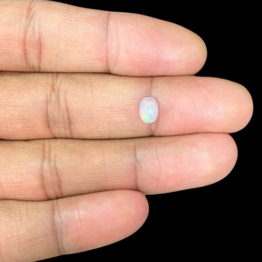 Natural White Ethiopian Opal Stone 0.63 Carats Oval Cabochon Shape 7.2 x 6.1 mm