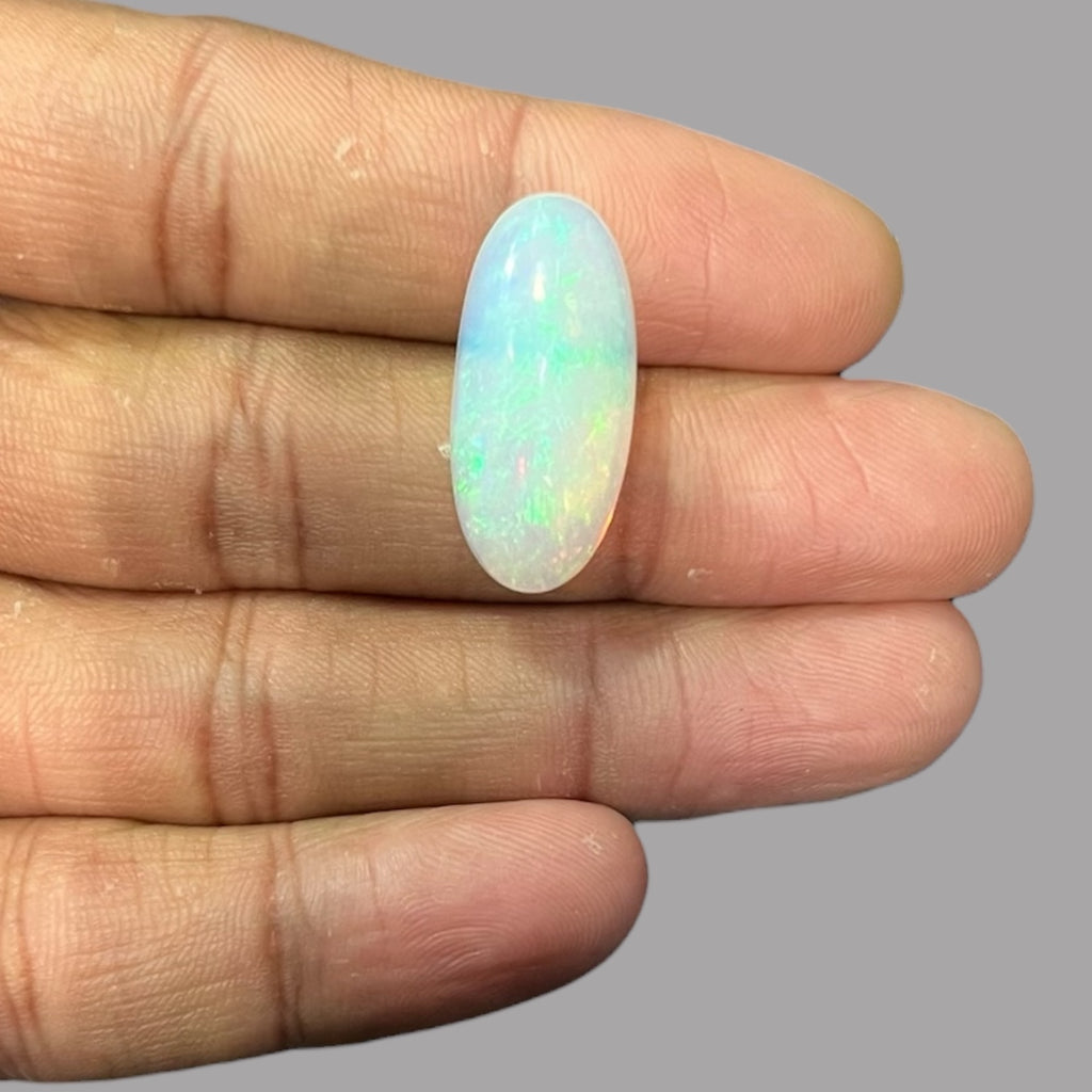 Natural White Ethiopian Opal Stone 12.54 Carats Oval Cabochon Shape 25.7 x 11.7 x 7.9 mm