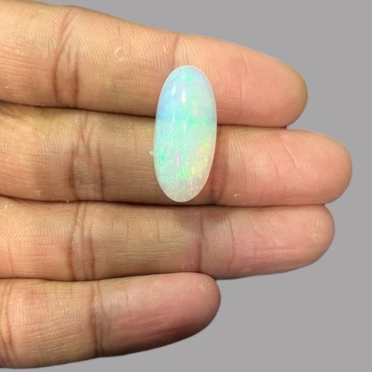 Natural White Ethiopian Opal Stone 12.54 Carats Oval Cabochon Shape 25.7 x 11.7 x 7.9 mm