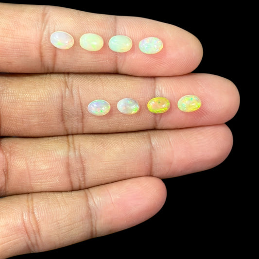 Natural White Ethiopian Opal Stone 14.79 Carats Oval Cabochon Shape 7 x 5 mm