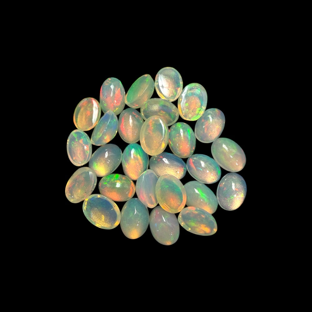 Natural White Ethiopian Opal Stone 15.81 Carats Oval Cabochon Shape  7 x 5 mm