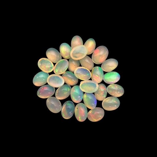 Natural White Ethiopian Opal Stone 17.27 Carats Oval Cabochon Shape 7 x 5 mm