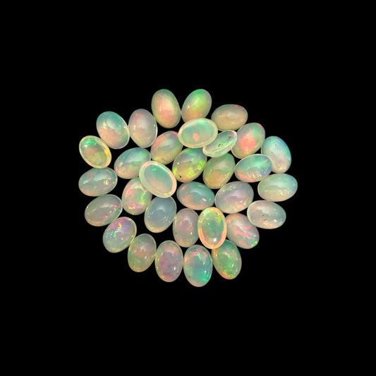 Natural White Ethiopian Opal Stone 18.40 Carats Oval Cabochon Shape 7 x 5 mm