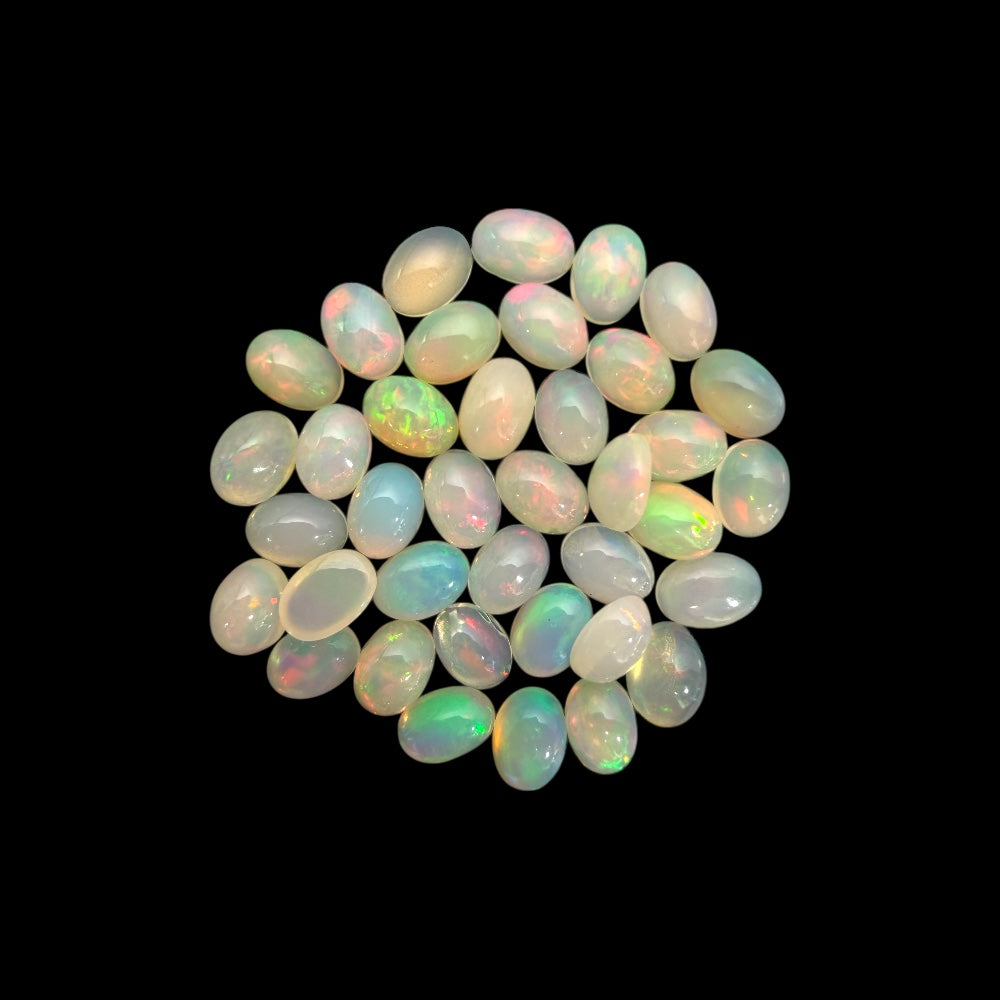 Natural White Ethiopian Opal Stone 22.75 Carats Oval Cabochon Shape 7 x 5 mm