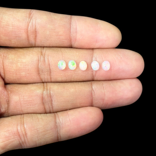 Natural White Ethiopian Opal Stone 22.86 Carats Oval Cabochon Shape 5 x 4 mm