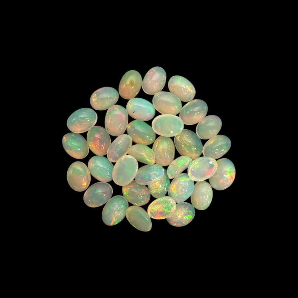 Natural White Ethiopian Opal Stone 22.93 Carats Oval Cabochon Shape 7 x 5 mm