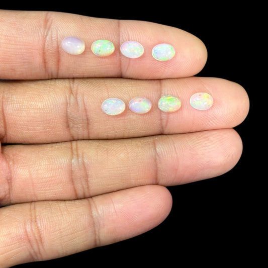 Natural White Ethiopian Opal Stone 23.05 Carats Oval Cabochon Shape 7 x 5 mm