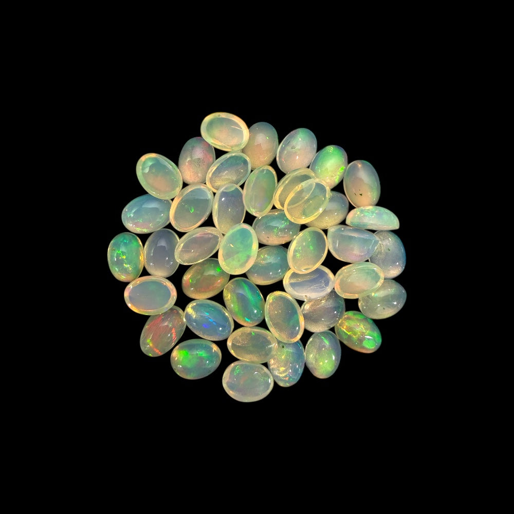 Natural White Ethiopian Opal Stone 23.05 Carats Oval Cabochon Shape 7 x 5 mm