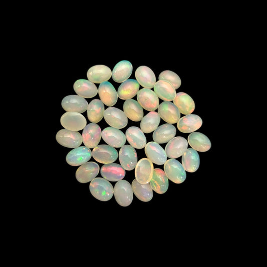 Natural White Ethiopian Opal Stone 23.39 Carats Oval Cabochon Shape 7 x 5 mm