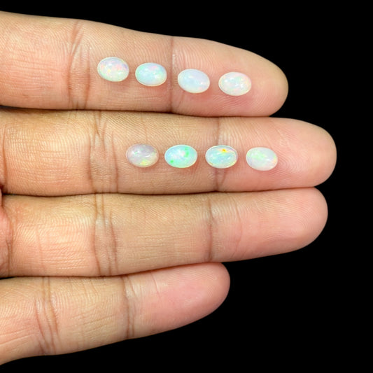 Natural White Ethiopian Opal Stone 24.14 Carats Oval Cabochon Shape 7 x 5 mm