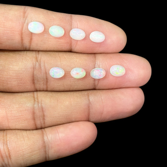 Natural White Ethiopian Opal Stone 24.66 Carats Oval Cabochon Shape 7 x 5 mm