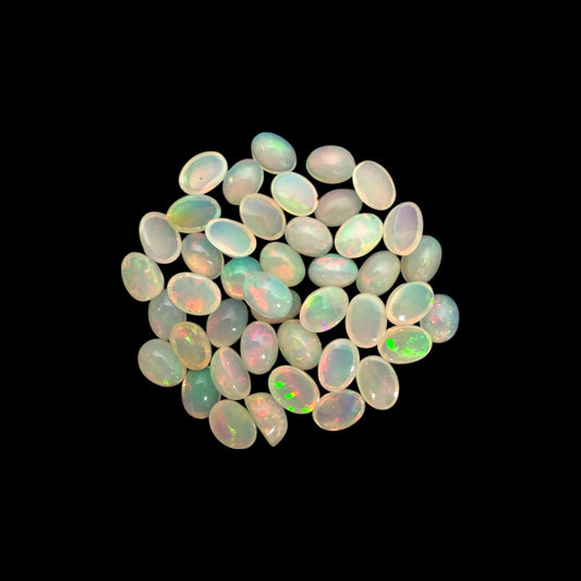 Natural White Ethiopian Opal Stone 24.66 Carats Oval Cabochon Shape 7 x 5 mm