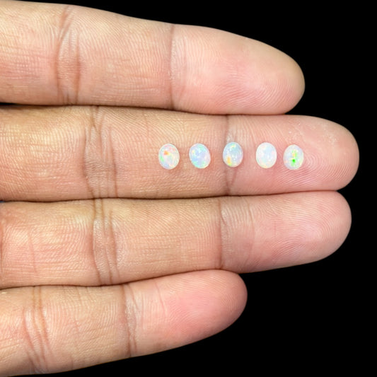 Natural White Ethiopian Opal Stone 24.72 Carats Oval Cabochon Shape 5 x 4 mm  