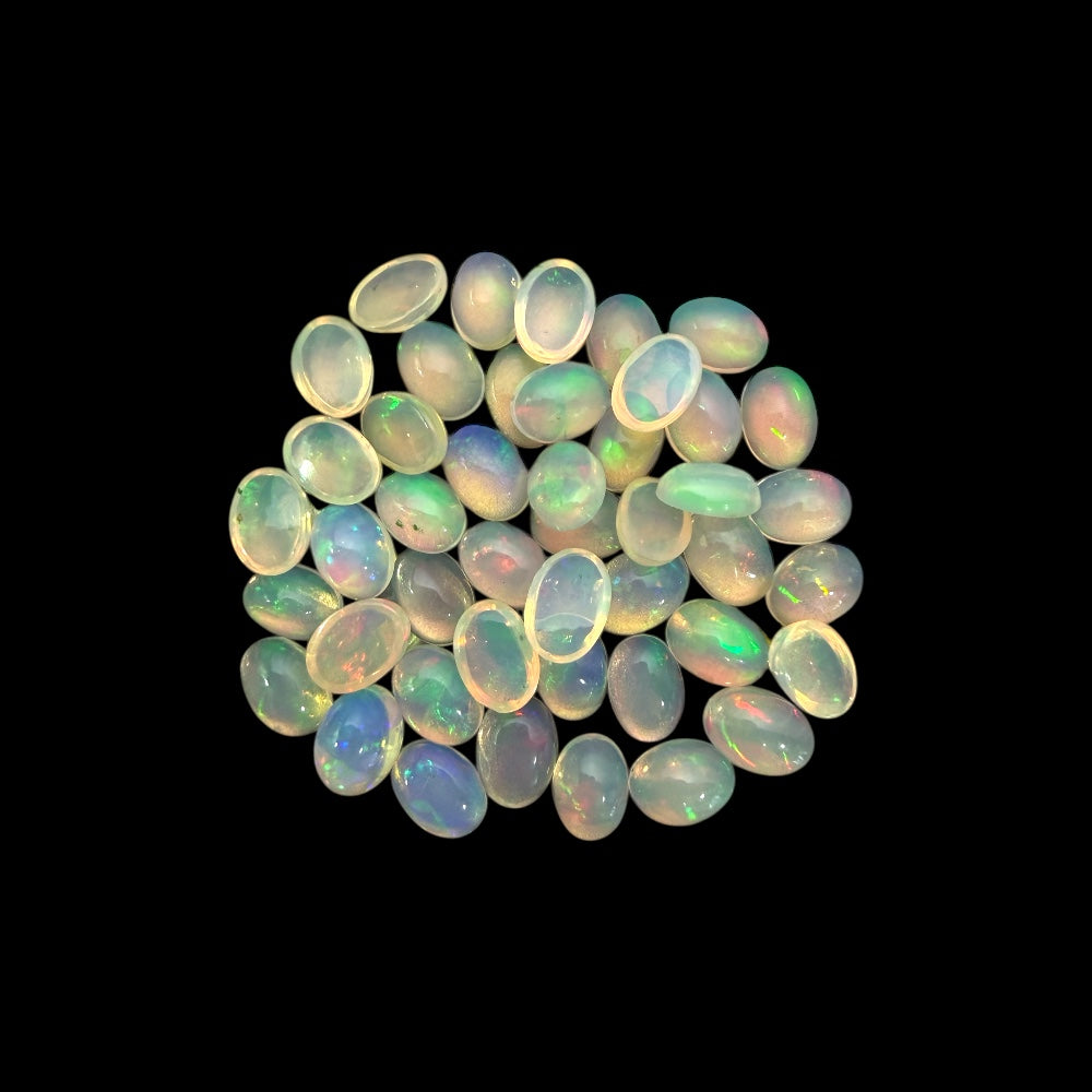 Natural White Ethiopian Opal Stone 24.79 Carats Oval Cabochon Shape 7 x 5 mm