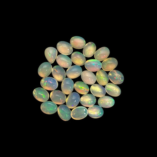 Natural White Ethiopian Opal Stone 25.43 Carats Oval Cabochon Shape 8 x 6 mm