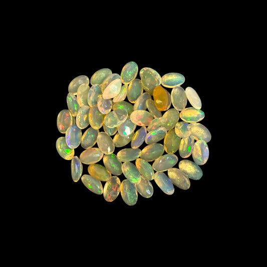 Natural White Ethiopian Opal Stone 9.61 Carats Oval Cabochon Shape 5 x 3 mm