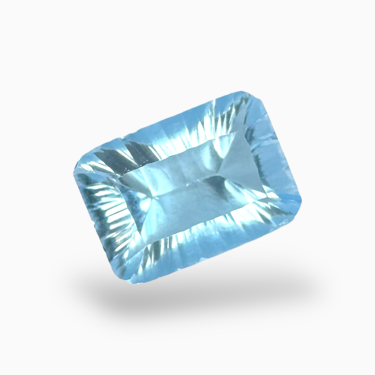 Buy Light Sky Blue Topaz 6.25 Carats Emerald Cut Shape Size 14X10mm Laser Cut