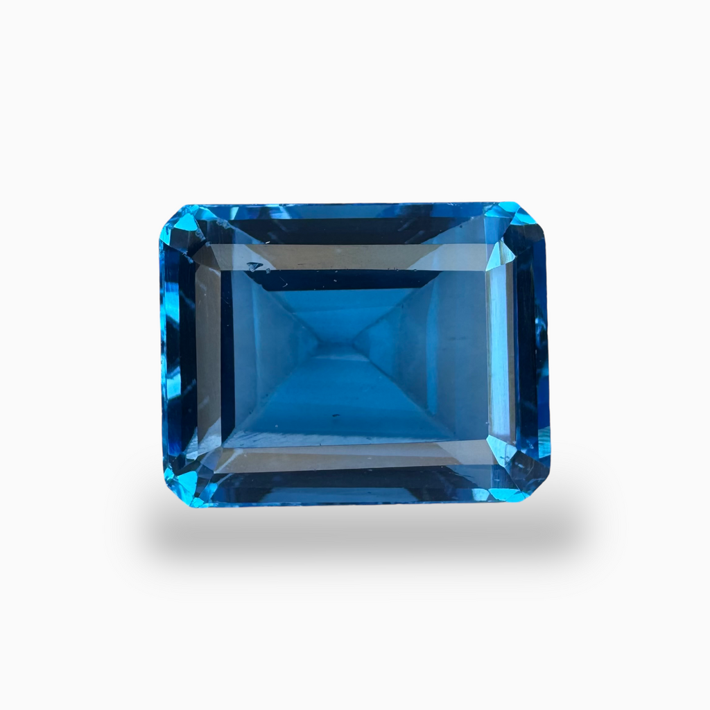 Buy Swiss Blue Topaz Emerald Cut Shape 18.68 Carats Stone Size 16X13mm
