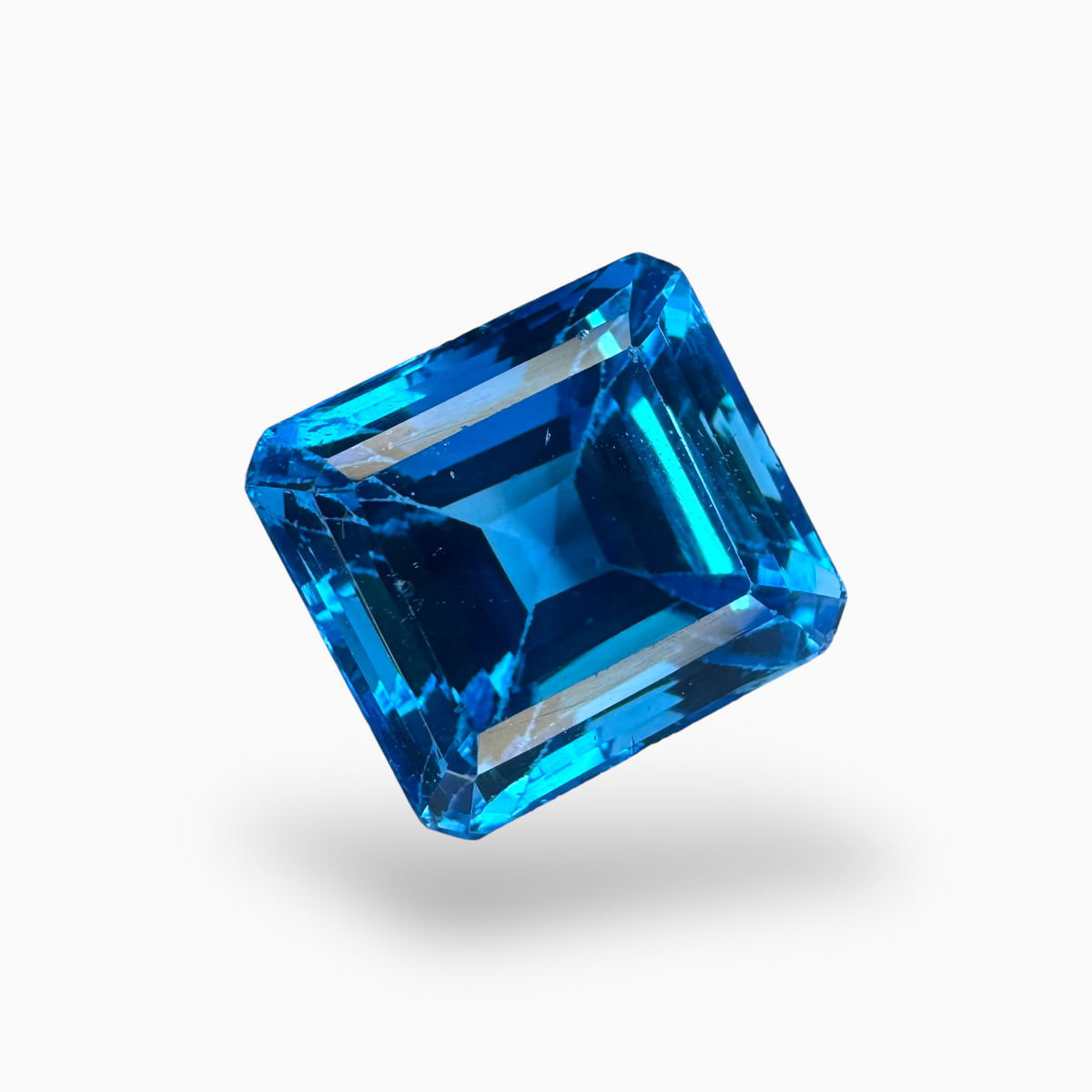 Swiss Blue Topaz Emerald Cut Shape 21.60 Carats Stone Size 14.5X13.5mm