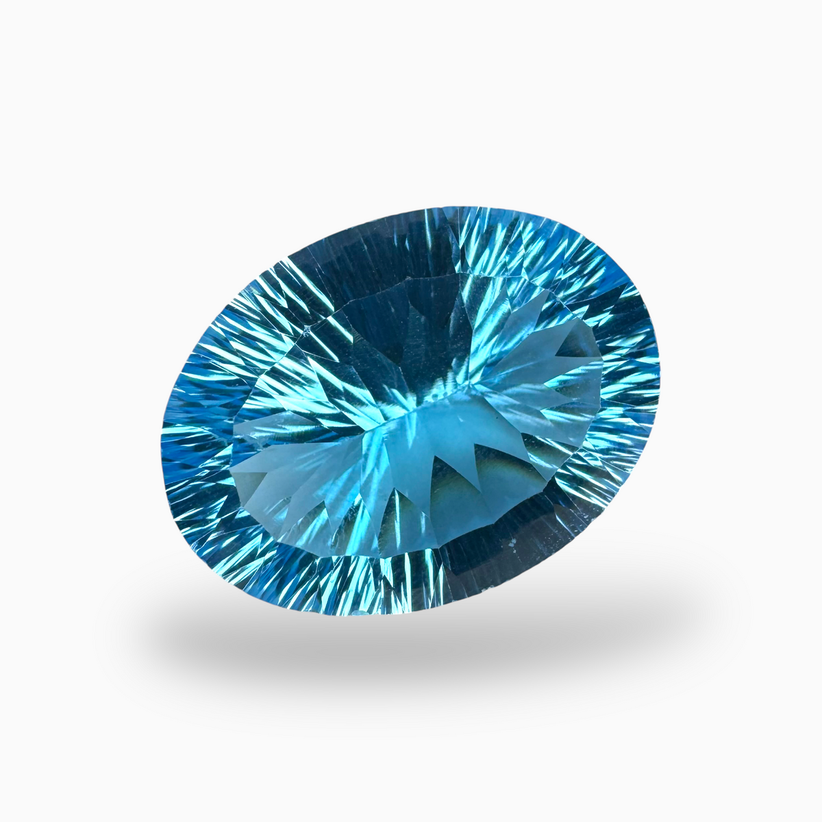 Swiss Blue Topaz Oval Shape 31.0 Carats Stone Size 23X17.5mm Fancy Laser Cut