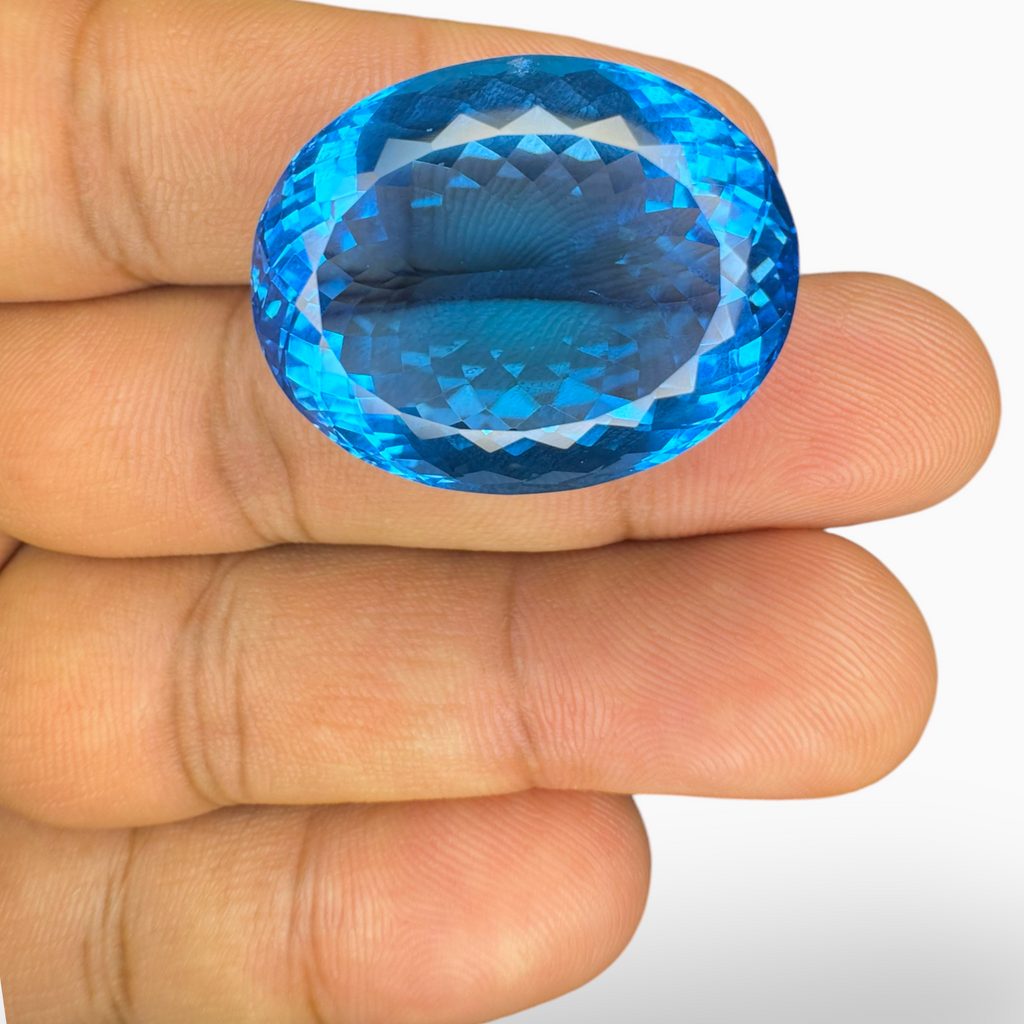 Swiss Blue Topaz 57.60 Carats Oval Shape Size 26X20.5mm Deep Sky Blue Color