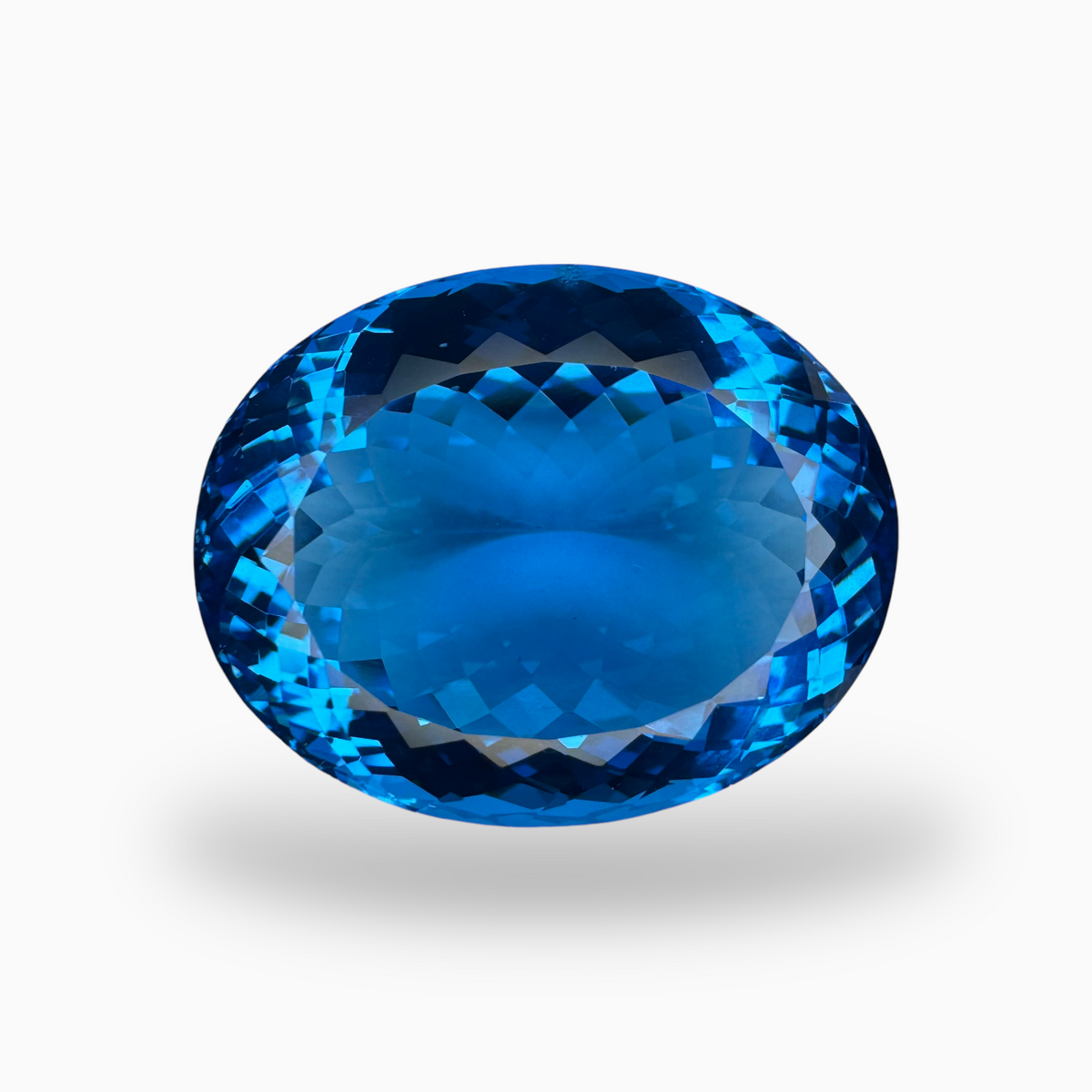 Swiss Blue Topaz 57.60 Carats Oval Shape Size 26X20.5mm Deep Sky Blue Color