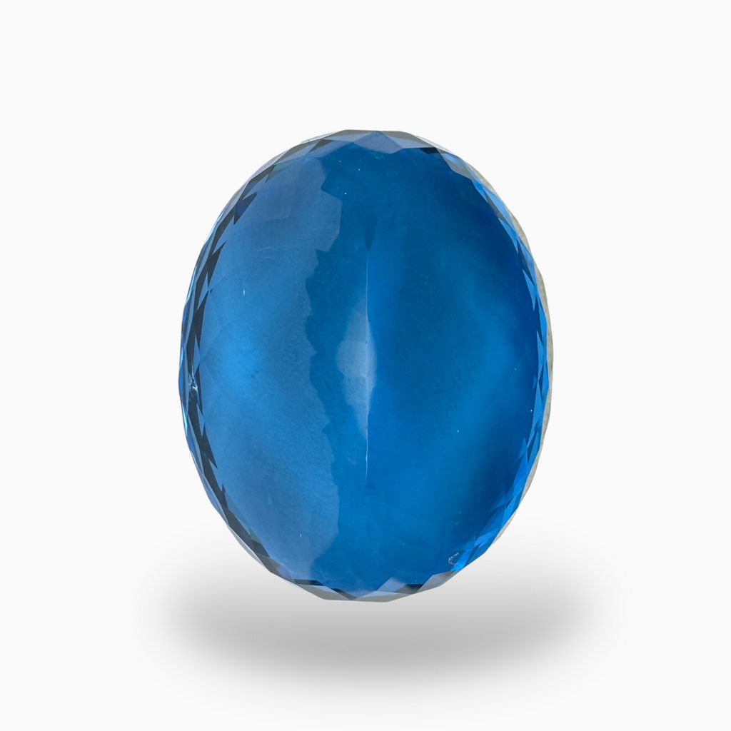 Swiss Blue Topaz 57.60 Carats Oval Shape Size 26X20.5mm Deep Sky Blue Color