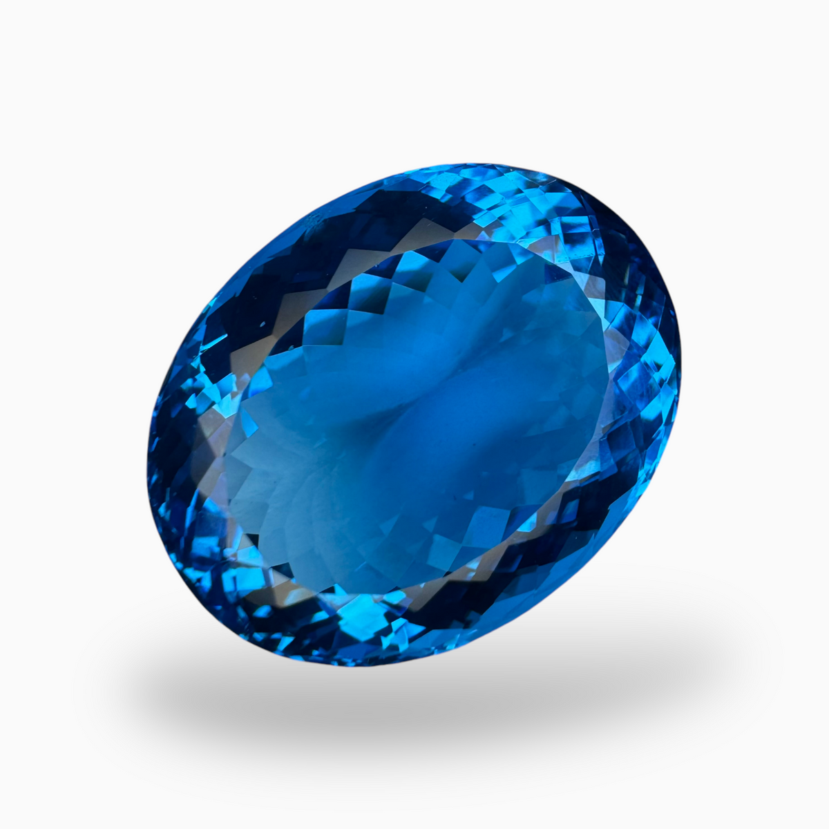 Swiss Blue Topaz 57.60 Carats Oval Shape Size 26X20.5mm Deep Sky Blue Color