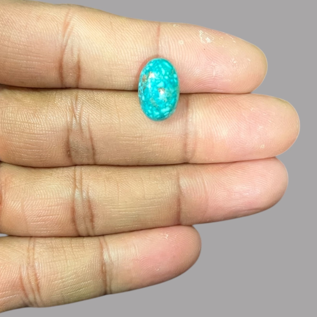 Turquoise Stone 6.74 Carats 14.6 x 9.4 x 6.7 mm in Oval