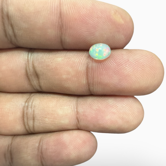 Natural White Color Ethiopian Opal Stone 0.61 Carats Oval Cabochon Shape  7X5mm