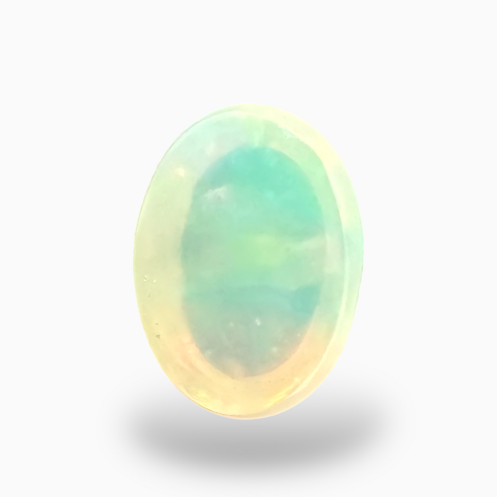 Natural White Color Ethiopian Opal Stone 0.61 Carats Oval Cabochon Shape  7X5mm