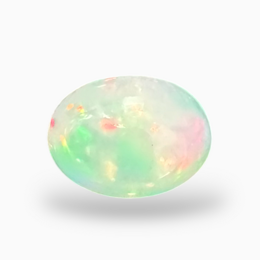 Natural White Color Ethiopian Opal Stone 0.61 Carats Oval Cabochon Shape  7X5mm