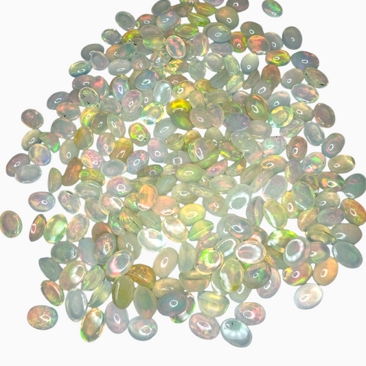 Natural White Color Ethiopian Opal Stone 0.61 Carats Oval Cabochon Shape  7X5mm