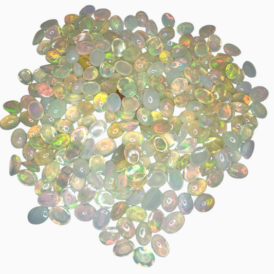 Natural White Color Ethiopian Opal Stone 0.8 Carats Oval Cabochon Shape 8X6mm