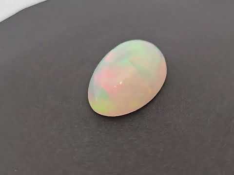 for sale Natural White Ethiopian Opal  Stone 14.86 Carats Oval Cabochon Shape  ( 23x15.5 mm ) 