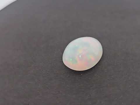 for sale Natural White Ethiopian Opal  Stone 5.47 Carats Oval Cabochon Shape  ( 15.5x12 mm )
